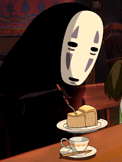 GIF animado del personaje Sin rostro de la película El Viaje de Chihiro comiendo un pedaso de pastel